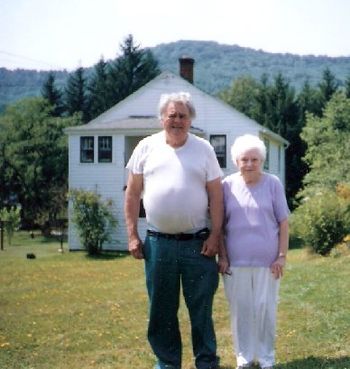 Bill's mom and dad stand in front of his boyhood home on Bolivar Drive in Bradford.
