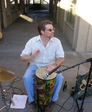 Dave plays percussion at an outdoor concert
