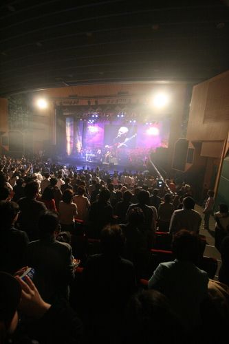 People on their feet during worship
