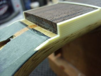 Here is where the new headstock binding will transition into the existing fretboard binding...

