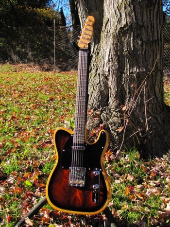 A custom-built Telecaster, with a lacquer-finished ash and walnut body.......follow along.....
