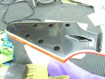 The headstock was sprayed black and then clear coated...
