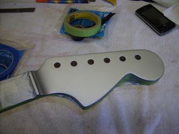 The face of the headstock is sprayed Inca Silver to match the body...
