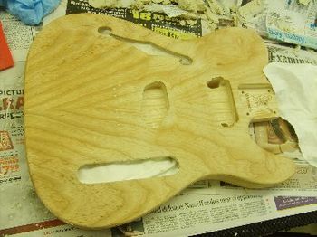 Filling the pores in the swamp ash with some oil-based grain filler
