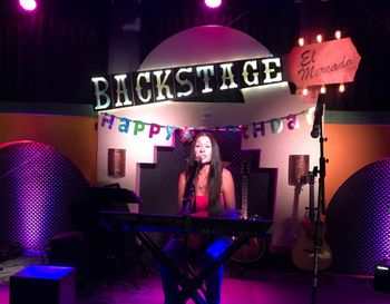 Kimberlee M Leber Sharing Her Song on the Keyboard in Austin TX
