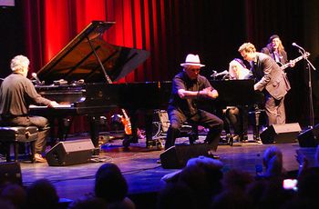 Craig plays while Bob Seeley, at 83, makes his move off the keyboard and Liz Pennock and Michael Kaeshammer jam on the right with Dr. Blues. (Photo by Jim White)
