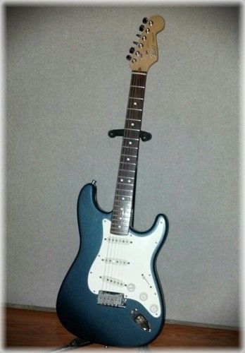 Fender American made Stratocaster with a rosewood fingerboard, sounds great but I play the other one with the Maple board more
