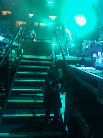 Vy watches her daddy on stage

