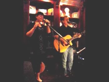 Singing an acoustic set with a friend at a local coffee house. January 2012
