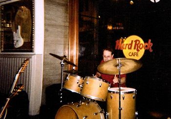 Here's Rob, pounding on his Slingerland set with Engine14 at the Hard Rock Café in Washington, D.C. Rob's Slingerland has served him well for many years. He uses a 22” medium ride cymbal which is a superb all-around ride and provides a great mid-range pitch. Rob uses a Pearl P2000C Eliminator Chain Drive Bass Drum Pedal.
