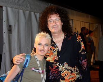 With Brian May
