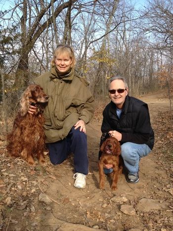 "Connor" (orange boy) with his new family. He lives in Kansas with Skip & Brenda Gast & their other irish setter "Libby". This boy is going to have a wonderful life! Dec. 2012
