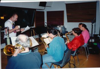 Bill Sample conducts the horn section, during the recording of Power In Our Hands. Bill Sample, Ian McDougall, Tom Colclough, Tom Keenlyside, Paul Baron, Vince Mai.
