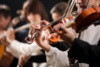 Pickering Academy students playing violin