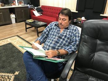 David going over notes before recording.

