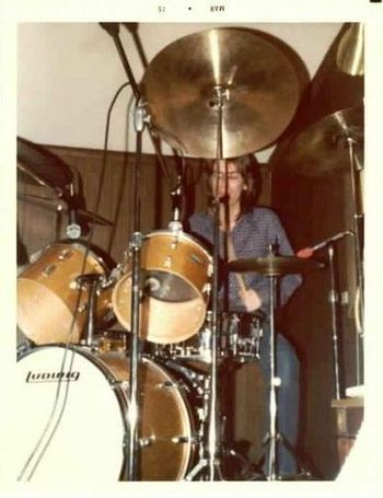 John tries his hand at drums during the One In Versailles sessions in early 1975 at La Cabane.
