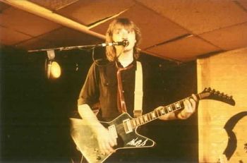 Jeff plays his blue Hamer guitar during a gig in 1979.
