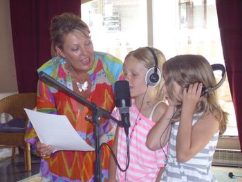 Local stars singing for all their might. Recording the "The Rainbow Song"
