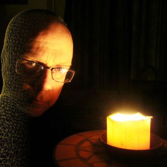 Gregorian Rock, Dale Benedict, face lit by candle, face partial computer wireframe