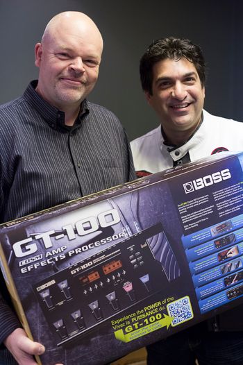 President-CEO of Roland Canada Paul McCabe giving Yiannis a Boss Gt-100
