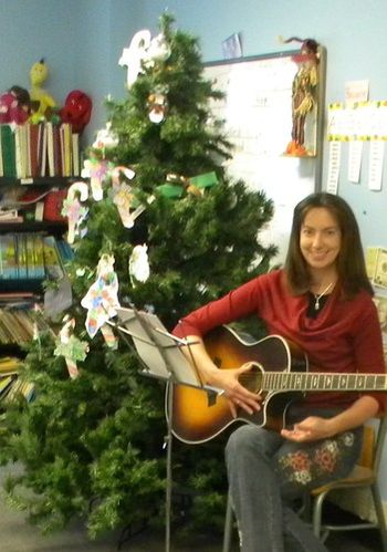 Kim at STMA playing guitar for 1st and 2nd Grade Classes. December 2011
