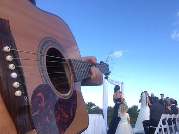 Acoustic guitarist selfie at a Newcastle wedding ceremony in Caves Beach
