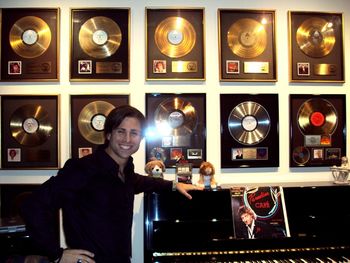 By Marty Panzer's piano (with many gold and platinum Barry Manilow records in the background)
