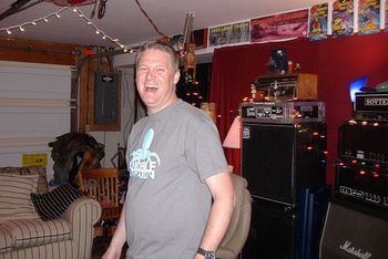 Producer Russ Fox smiles as Skid Baxter surprises him with a camera at Fox's Broadmoor Recording Studios in Huntington, WV in 2006.
