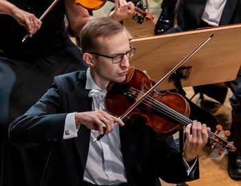 Concertmaster Marcin Ostrowski during the 'Gears of Time' concert, composed to commemorate the centennial of granting municipal rights to the city of Zabrze. [photo by Pawel Janicki]

