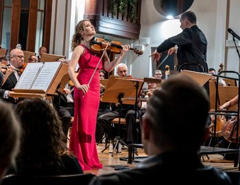 Violinist Zofia Olesik performs the solo parts of the composition 'Gears of Time' written by Pawel Pudlo, during its world premiere at the Zabrze Philharmonic. [photo by Pawel Janicki]
