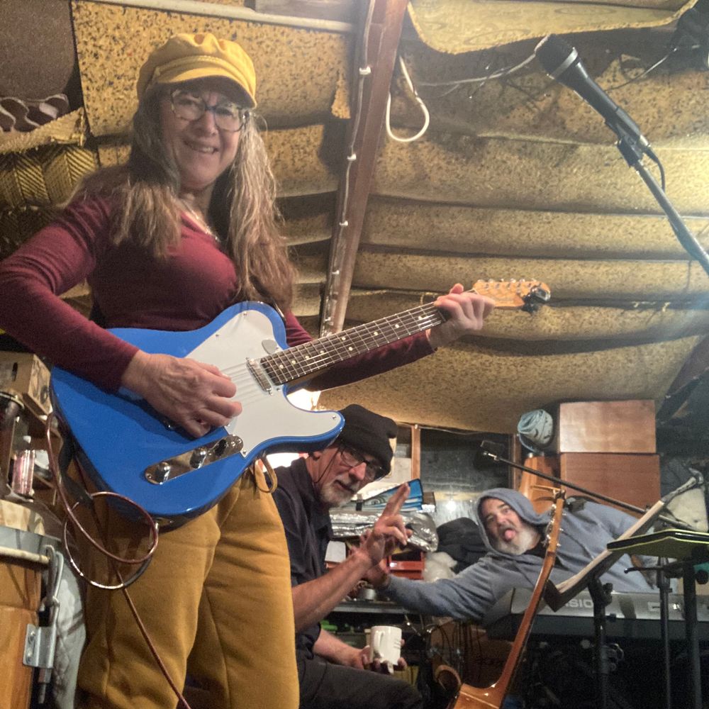 Kristine Best with her blue telecaster at a garage jam with muso friends.