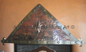Copper and Iron Fireplace Shroud. Custom repousse. Forged Iron Trim with Custom Clavos. Location: Fresno, CA
