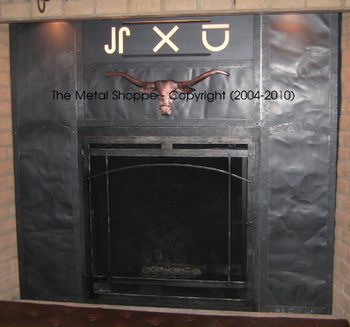 Custom Fabricated Steel and Sheet Metal Fireplace Surround for gas insert. Customized with customer's cattle brands and copper steer head / Location: La Grande, CA
