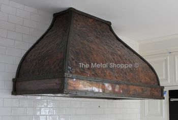 Bell Shape Hammered Copper Kitchen Hood with Forge/Welded Iron Strap Accents. Location: Hillsborough, CA
