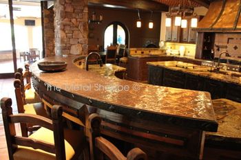 Custom Curved Copper Countertop with Forged Iron Trim and Custom Clavos. Matching Copper Hood. Location: Fresno, CA

