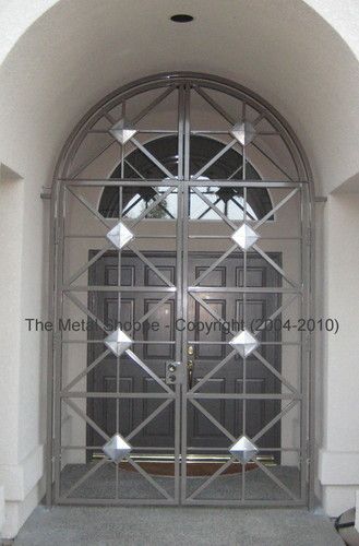 Custom Fabricated Steel Entry Door with Stainless Steel Pyramid Decorative Elements / Location: Fresno, CA
