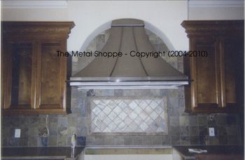 Custom French Curve Style Stainless Steel Kitchen Hood with Chrome Pot Rack / Location: Fresno, CA
