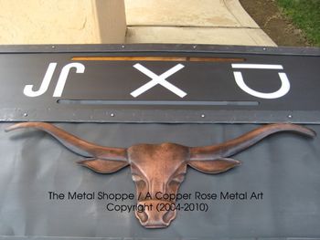 Copper Repousse Steerhead and Custom Metal Fireplace Surround / Copper Steer by A Copper Rose Metal Art / Location: Le Grande, CA
