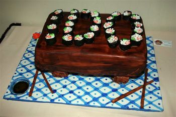 Grooms Cake with fondant sushi saying "I Do" for a groom that proposed with sushi arranged to say "will you marry me"
