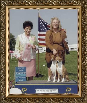 AKC CH/UKC Grand CH Rafiki's Memories or Midnight,CGC,JC & AKC CH/UKC Grand CH Akuaba The Opulecent Pearl,CGC,JC going Best Brace in Show at Northeastern Maryland Kennel Club on July 7, 2006. This was Pearls last show as part of the Brace team she was retired at age 12.
