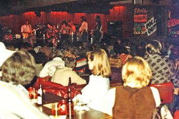 Onstage with Gary Stewart and the HTLA at the Palamino in North Hollywood, CA in Feb. 1980. From left Ralph Profetta on steel guitar, Bob Melton guitar, Gary Stewart, Mickey Raphael on harmonica, Darrell Dawson bass guitar, John Whalen guitar, T Ray Miller guitar.
