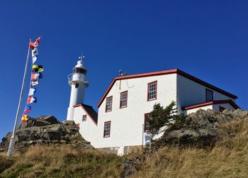 Beautiful afternoon at Lobster Cove Head Lighthouse. The lighthouse was built 1897 by shipping the iron pieces from St. John's and pulling them up the hill by oxen.
