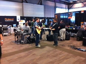 Musicians can never resist gear! A group of musicians jamming in the exhibit hall.
