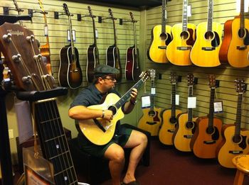 Gerald playing a lovely nylon-stringed Taylor at Halifax's Long & McQuade.
