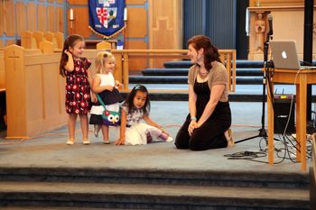 Things were very relaxed at the family service. Allison sat with these young worshipers during the prayers...
