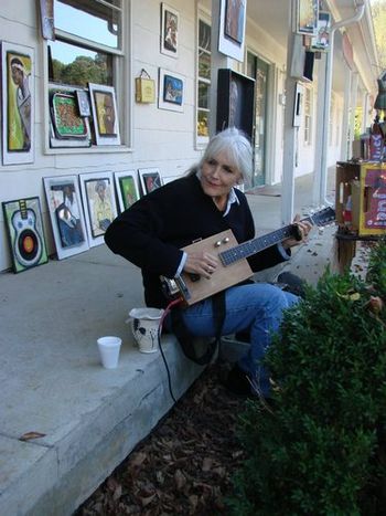 Joni w/ amped cigar box guitar & lots of her folk art/ 7th Annual Biscuits & Bluegrass Festival at the Loveless Cafe , Nashville 2011
