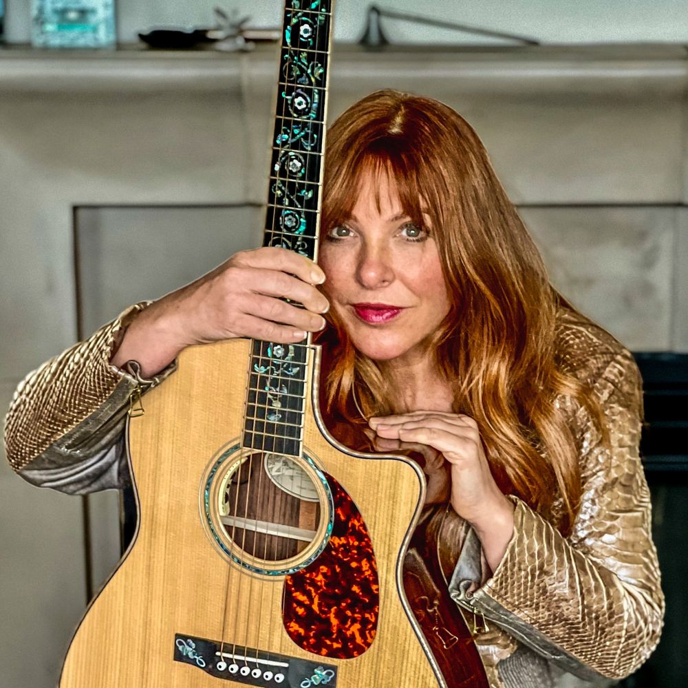 Joy Chapman with Acoustic Guitar