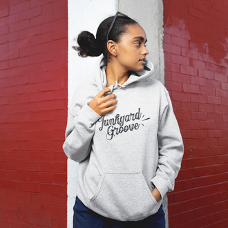 Girl wearing a junkyard groove hoodie light colors