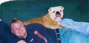 Son Matt and his Bulldog Mac. You have got to love the Bulldog. What a face!!! You can hear him snoring through the whole house!
