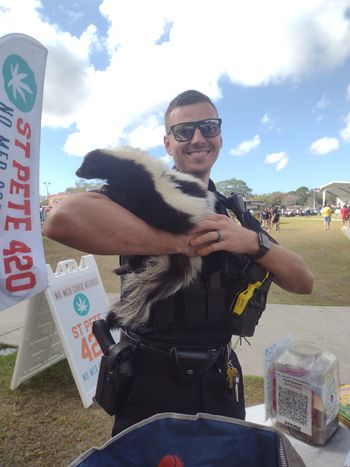 Pinellas County Police showing their support for the skunks at The 3rd Annual Taco Fest. Delilah just loves a man in uniform! Thank you for supporting the happy couple on their 2nd anniversary Officer!

